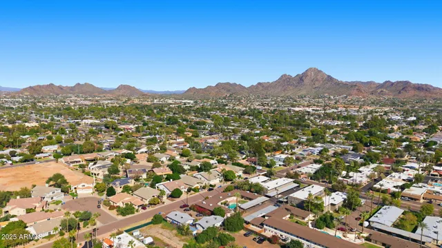 an aerial view of residential house and outdoor space