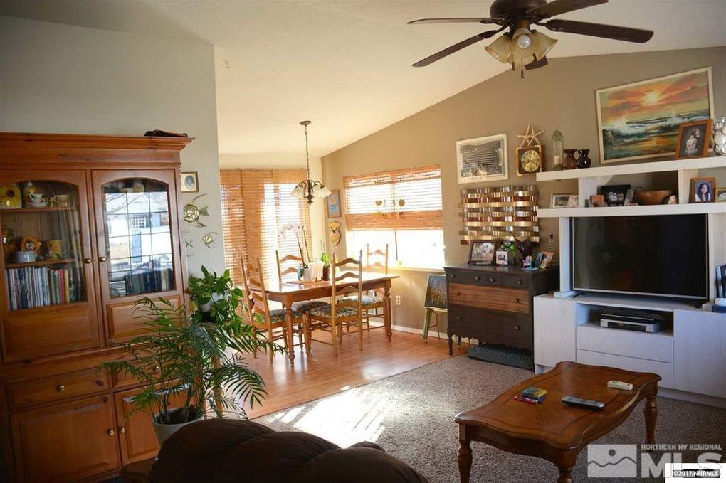 544 Yellow Jacket Road Dayton, NV 89403 - Photo 3 of 8 a living room with furniture a flat screen tv and floor to ceiling window