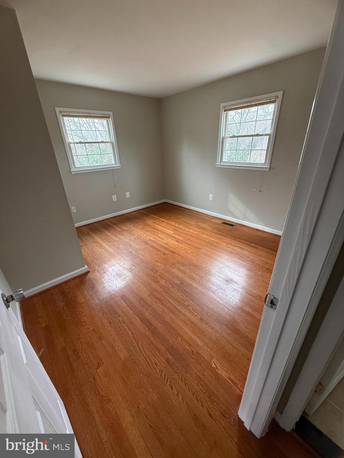 4542 Kingston Road Woodbridge, VA 22193 - Photo 3 of 15 an empty room with wooden floor and windows