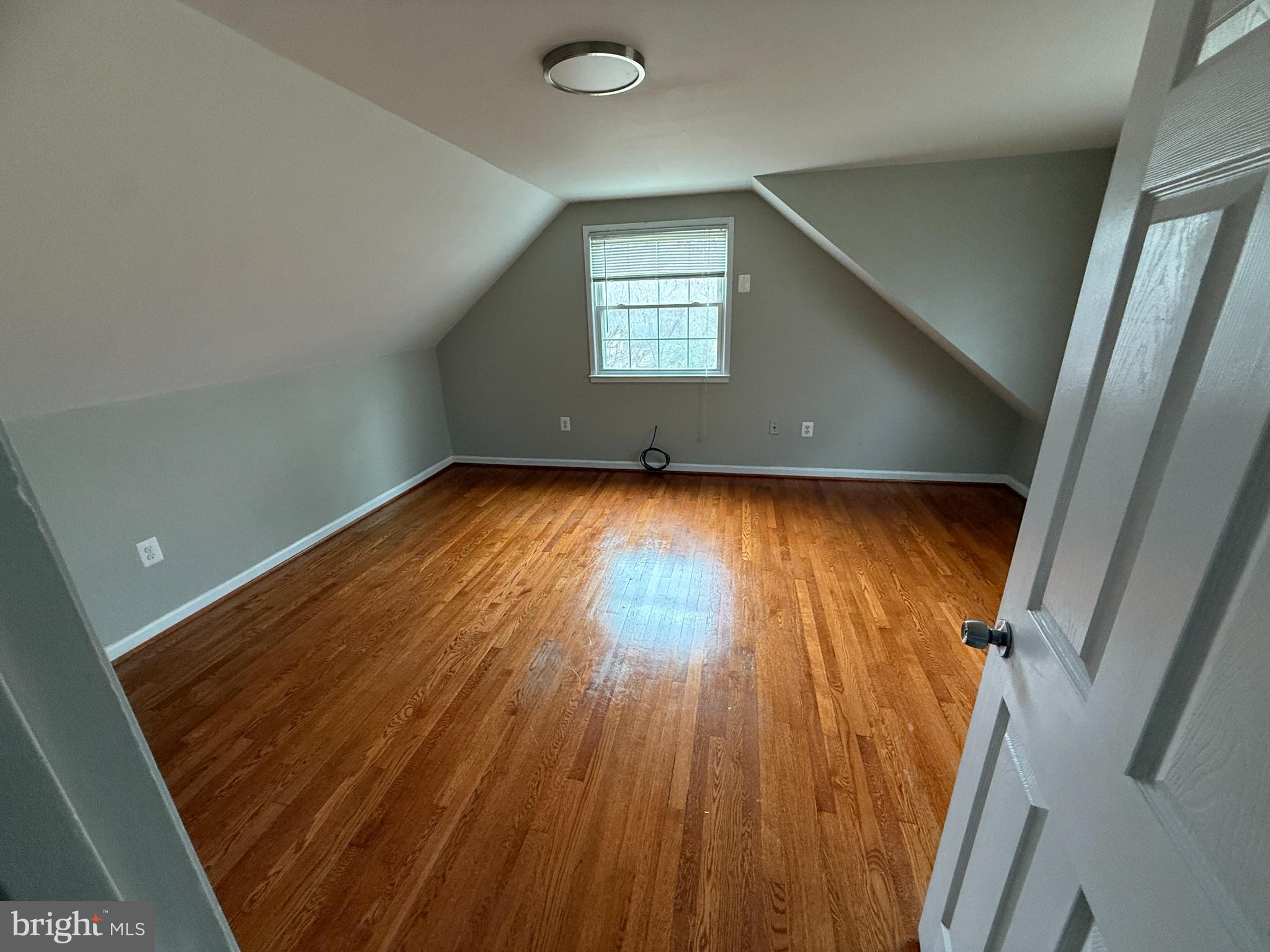 4542 Kingston Road Woodbridge, VA 22193 - Photo 7 of 15 an empty room with wooden floor and windows