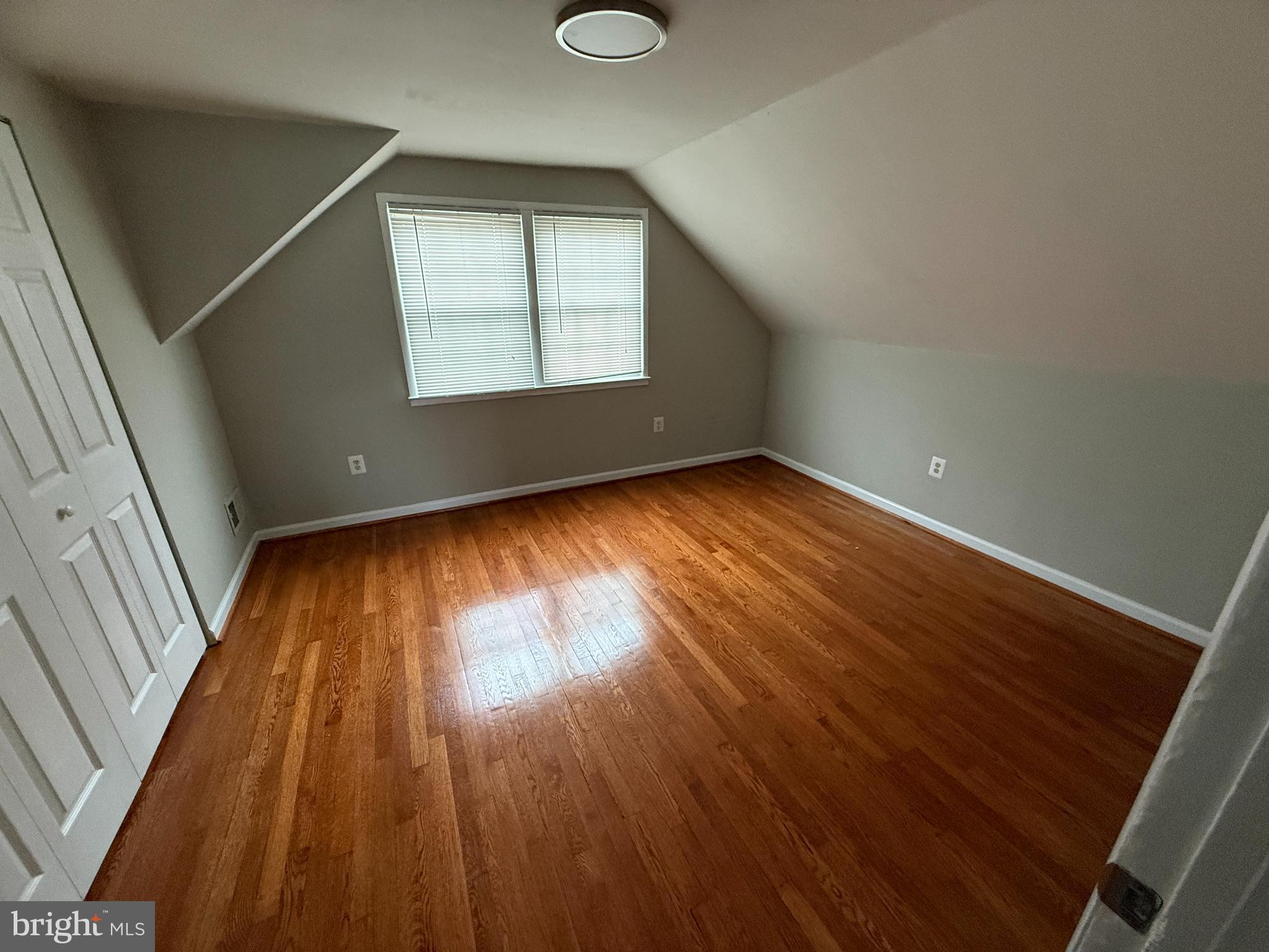 4542 Kingston Road Woodbridge, VA 22193 - Photo 9 of 15 an empty room with wooden floor and windows