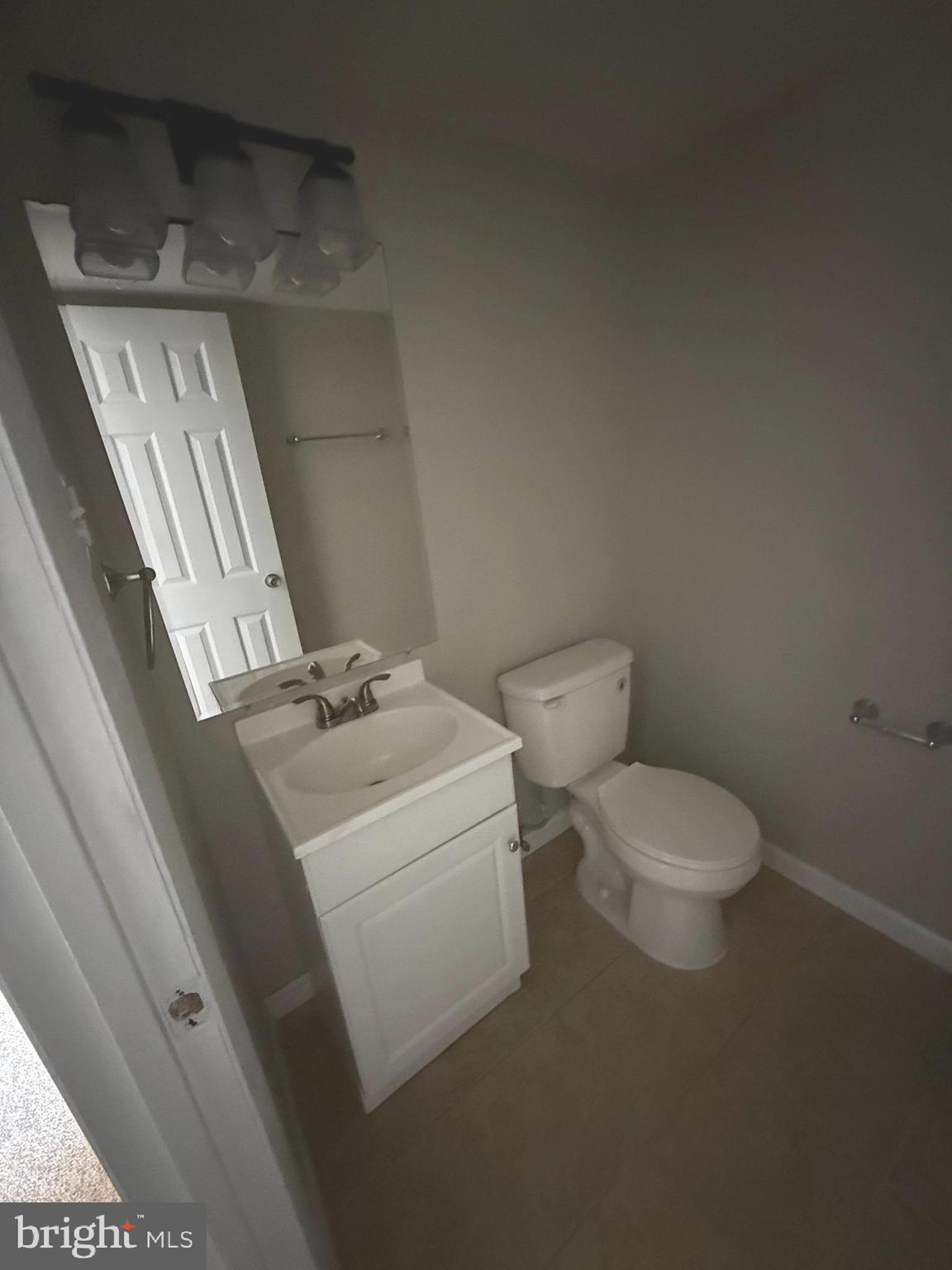 4542 Kingston Road Woodbridge, VA 22193 - Photo 10 of 15 a white toilet sitting next to a bathroom sink