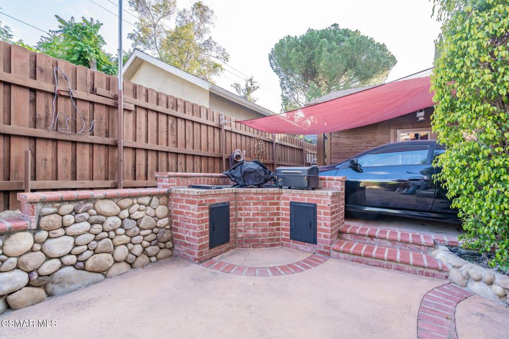6078 Peppertree Lane Simi Valley, CA 93063 - Photo 54 of 59 a view of a chairs and table in back yard of the house