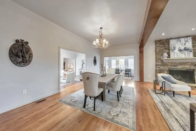 a kitchen with stainless steel appliances granite countertop a sink and wooden cabinets