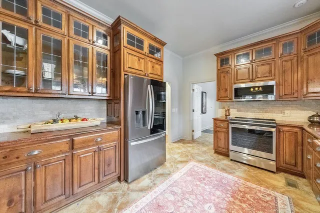 a bathroom with a tub a sink and a large mirror