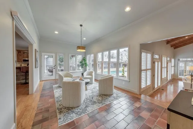 a en suite bathroom with a granite countertop sink and a mirror