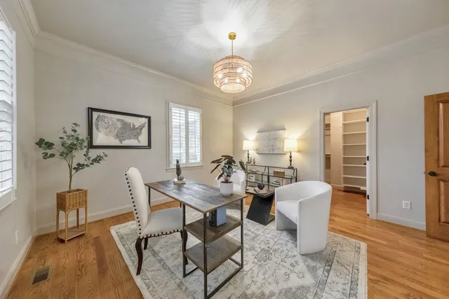 a view of a swimming pool with a yard and trees