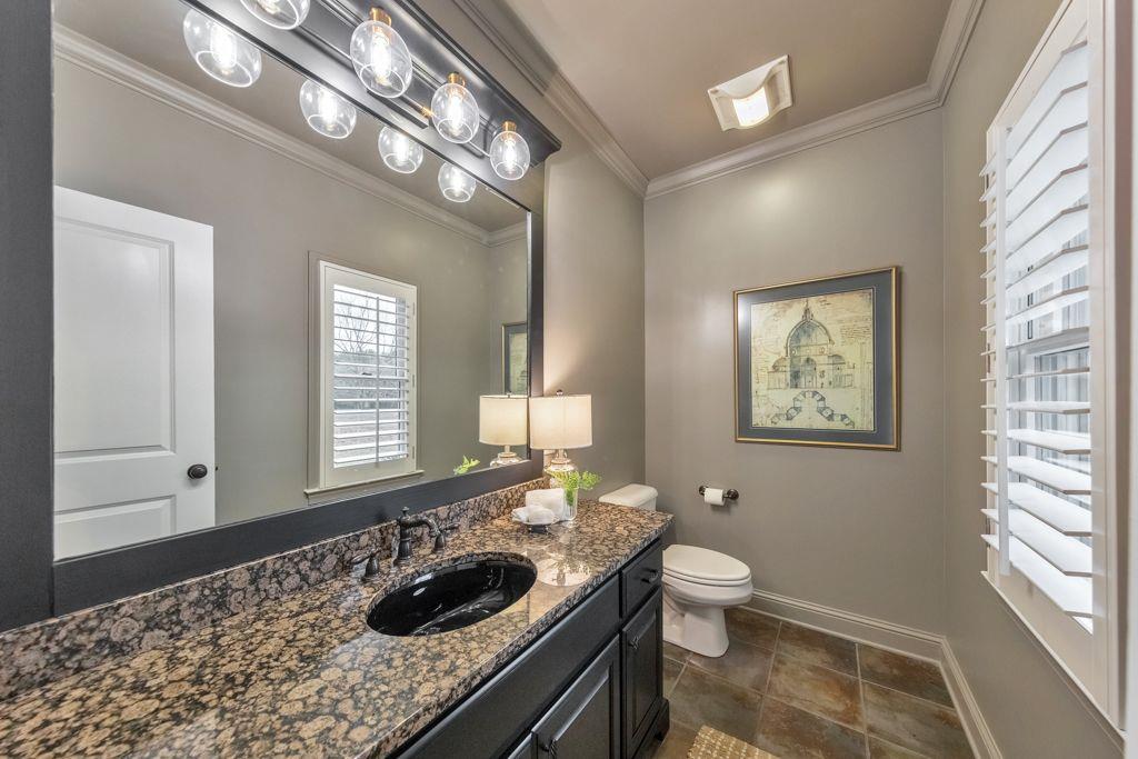 528 Old Alabama Road Southeast Cartersville, GA 30120 - Photo 42 of 101 a bathroom with a granite countertop sink a toilet a mirror and window