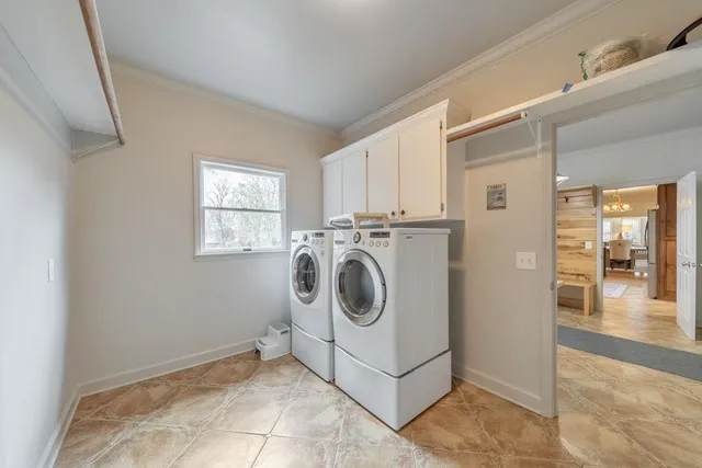 a view of a kitchen with a sink and cabinets