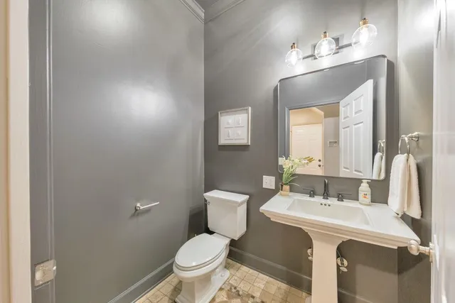 a view of a patio with a table and chairs under an umbrella