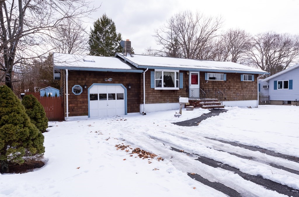 7 Robinson Road Beverly, MA 01915 - Photo 1 of 27 a view of a house with snow on the road