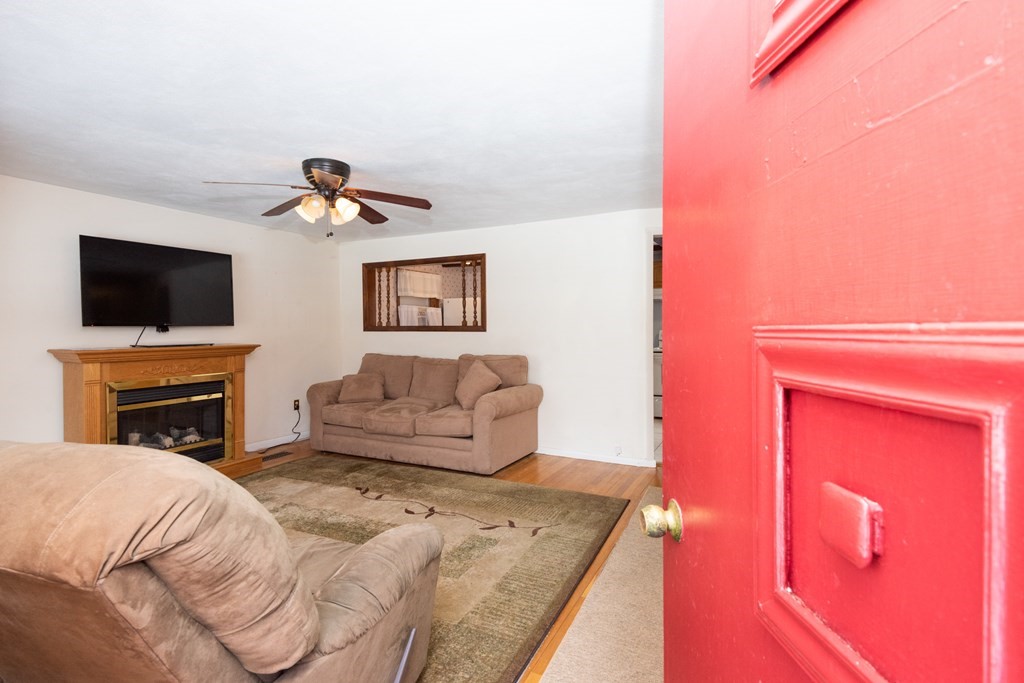 7 Robinson Road Beverly, MA 01915 - Photo 13 of 27 a bedroom with a bed and a flat screen tv