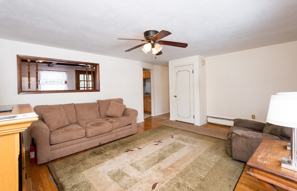 7 Robinson Road Beverly, MA 01915 - Photo 15 of 27 a living room with furniture and a ceiling fan