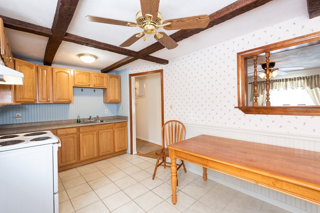 7 Robinson Road Beverly, MA 01915 - Photo 17 of 27 a kitchen with sink cabinets and window
