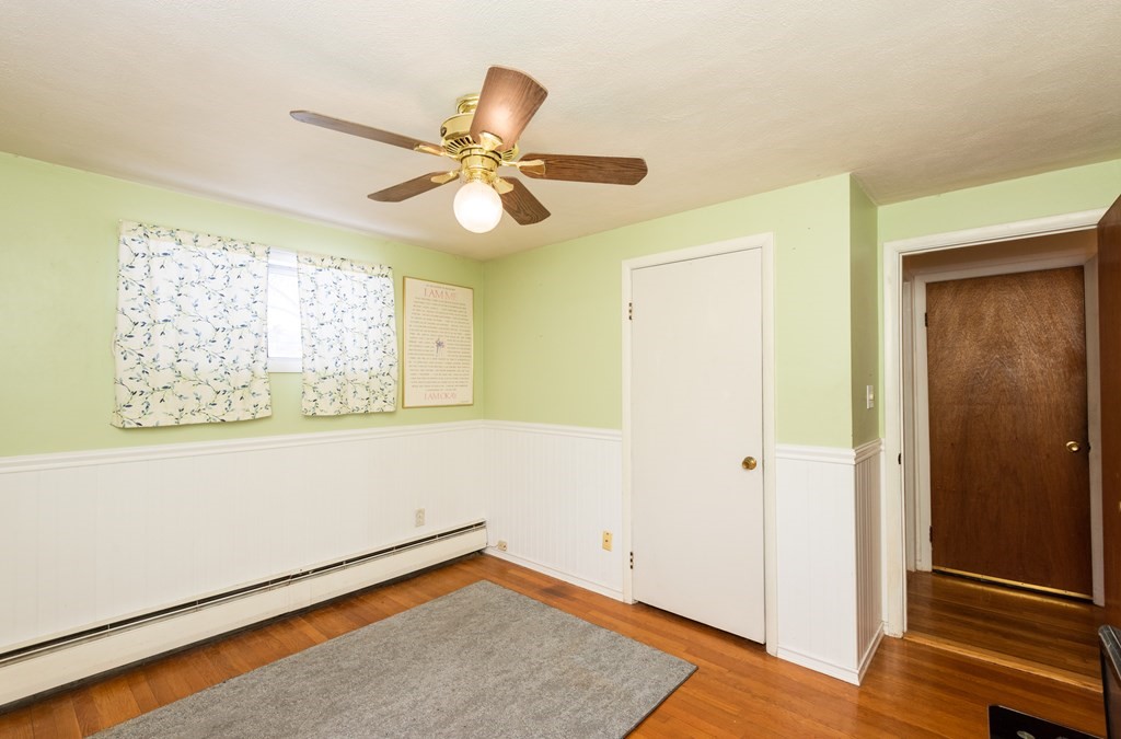 7 Robinson Road Beverly, MA 01915 - Photo 21 of 27 a view of empty room with wooden floor and fan