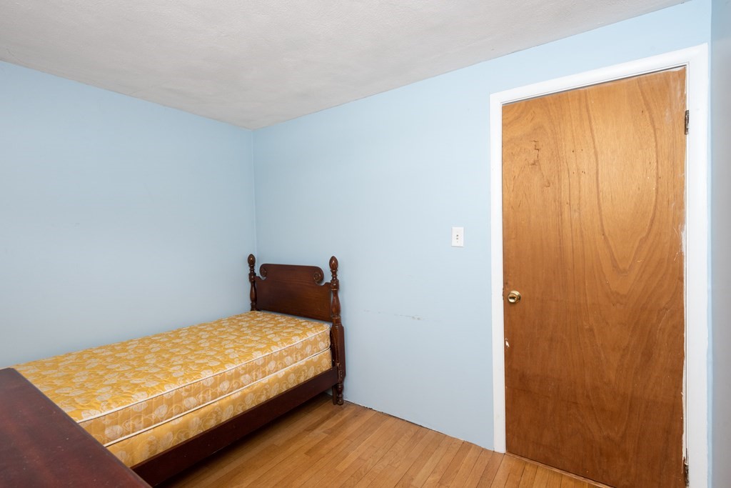 7 Robinson Road Beverly, MA 01915 - Photo 22 of 27 a bedroom with a bed