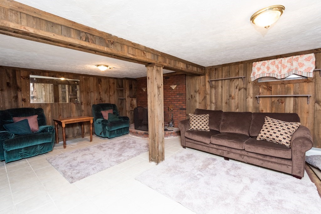 7 Robinson Road Beverly, MA 01915 - Photo 23 of 27 a living room with furniture and a large window