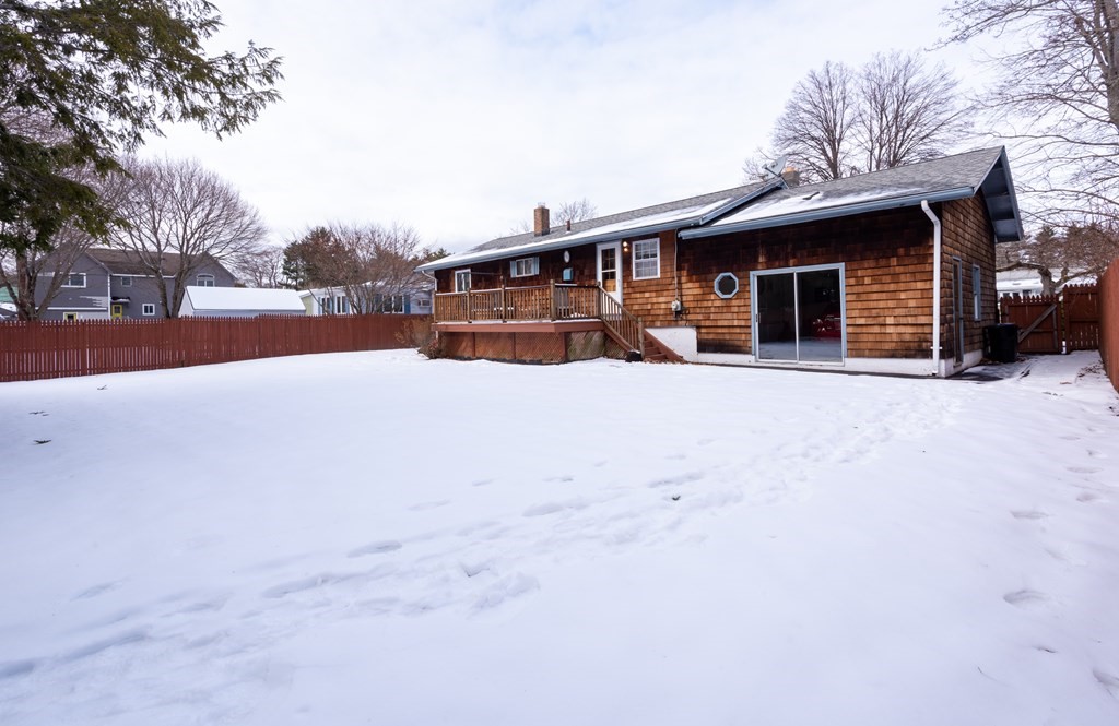 7 Robinson Road Beverly, MA 01915 - Photo 4 of 27 a view of a house with a yard covered in snow