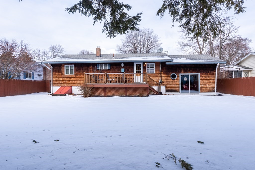 7 Robinson Road Beverly, MA 01915 - Photo 5 of 27 a view of a house with a yard and sitting area