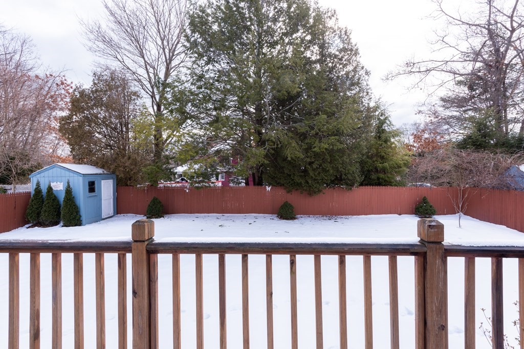 7 Robinson Road Beverly, MA 01915 - Photo 7 of 27 a view of a two chairs with the trees in the background