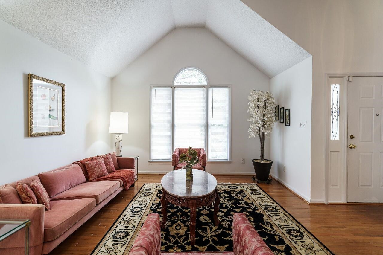 5305 Calverton Drive Raleigh, NC 27613 - Photo 6 of 34 Wood flooring and abundant natural light Living Room
