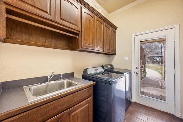 a living room with a bed furniture and a flat screen tv