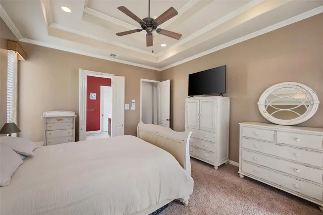a en suite bathroom with a granite countertop sink and a mirror