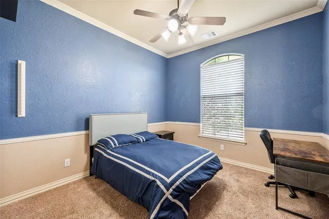 a room with pool table and windows