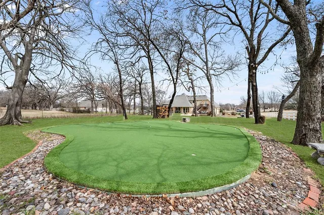 a room with lots of wooden furniture and a rug