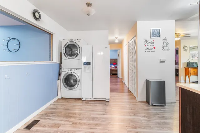 a view of a storage and utility room with washer and dryer
