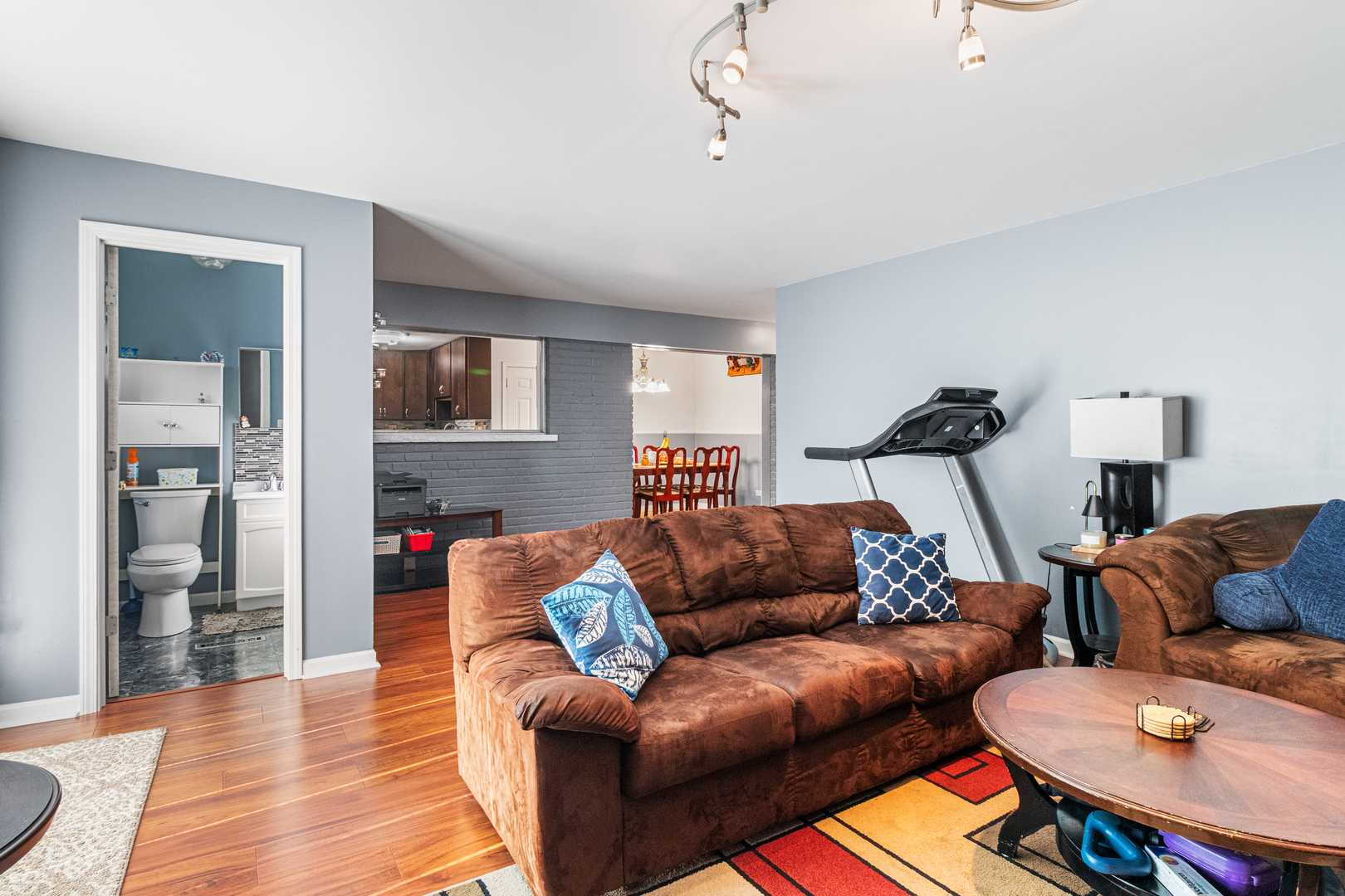379 Stone Place Wheeling, IL 60090 - Photo 17 of 27 a living room with furniture and a wooden floor