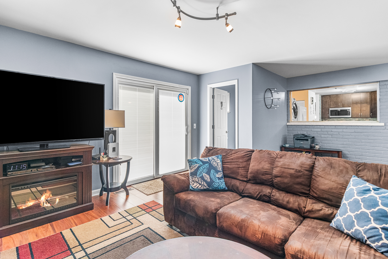 379 Stone Place Wheeling, IL 60090 - Photo 19 of 27 a living room with furniture and a flat screen tv