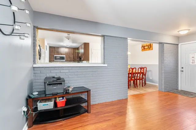 a view of a livingroom with furniture and wooden floor