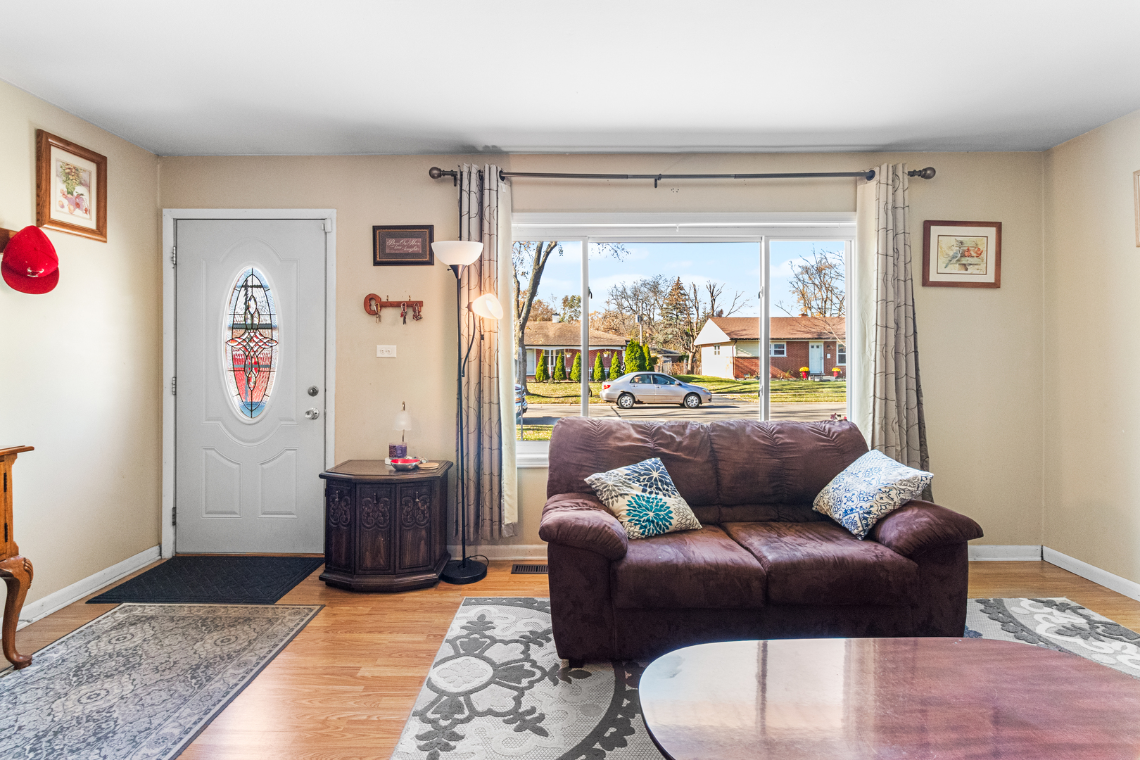 379 Stone Place Wheeling, IL 60090 - Photo 2 of 27 a living room with furniture and a rug