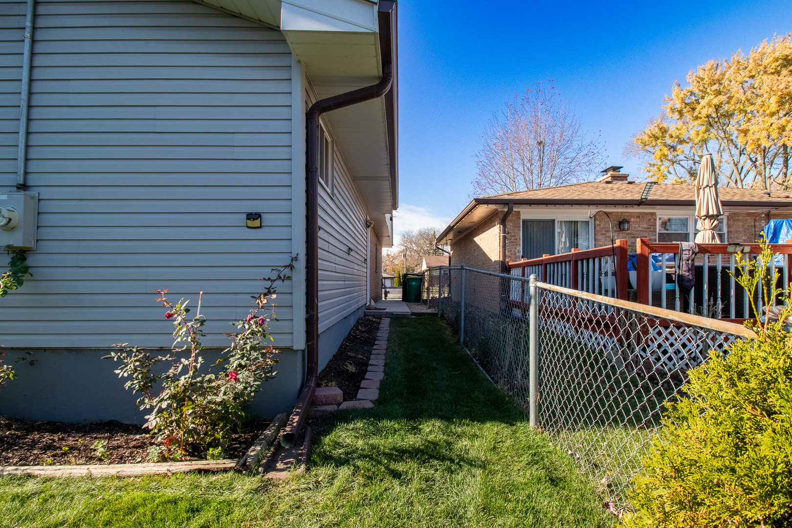 379 Stone Place Wheeling, IL 60090 - Photo 26 of 27 a view of a house with wooden fence