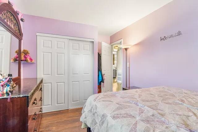 a bed room with a bed and a dresser