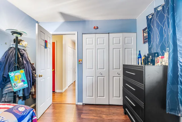 a view of a hallway with furniture and toys