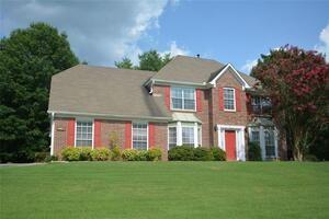 front view of a house with a yard
