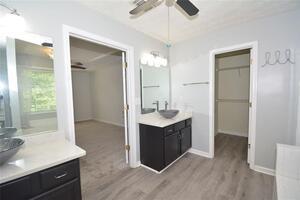 1740 Big Haynes Court Southwest Grayson, GA 30017 - Photo 17 of 29 a bathroom with a sink and a mirror