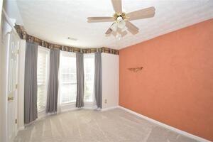 1740 Big Haynes Court Southwest Grayson, GA 30017 - Photo 26 of 29 wooden floor in an empty room with a window