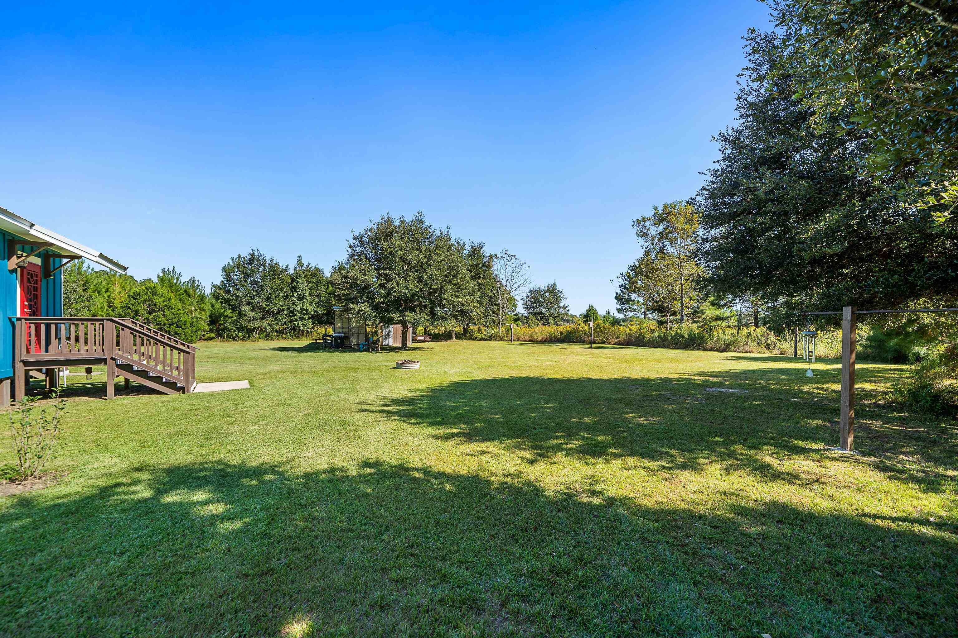 24616 Bretz Lane Elberta, AL 36530 - Photo 38 of 42 Tranquil backyard with mature trees and plenty of space.