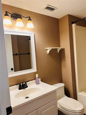 a bathroom with a shower and a toilet