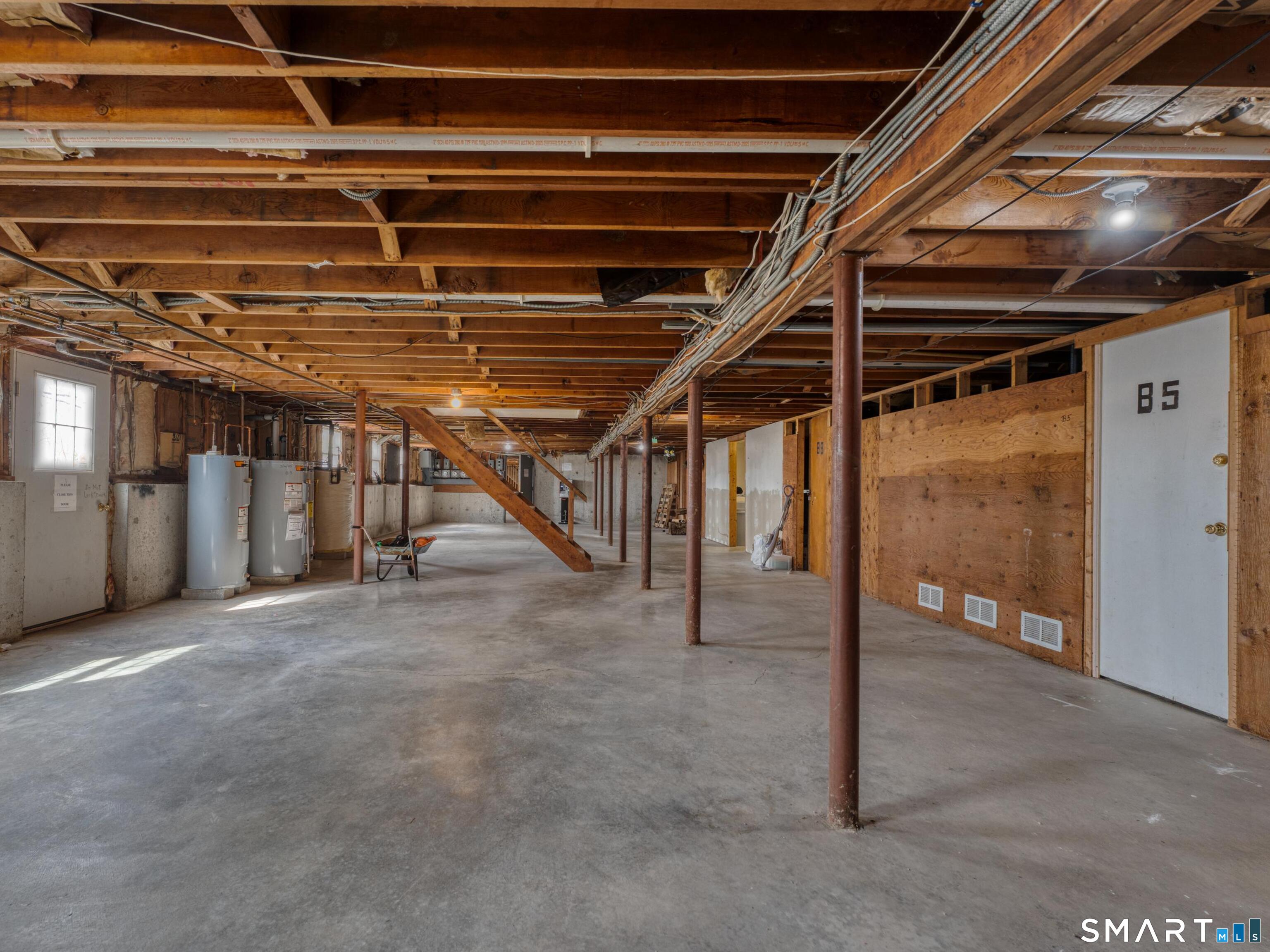 280 East Main Street, Unit B5 Clinton, CT 06413 - Photo 16 of 19 For basement access, there are interior stairs and a basement walk-out which leads to the back yard and parking lot. There is also a secured storage unit and hot water heater specifically for unit B5 located here.