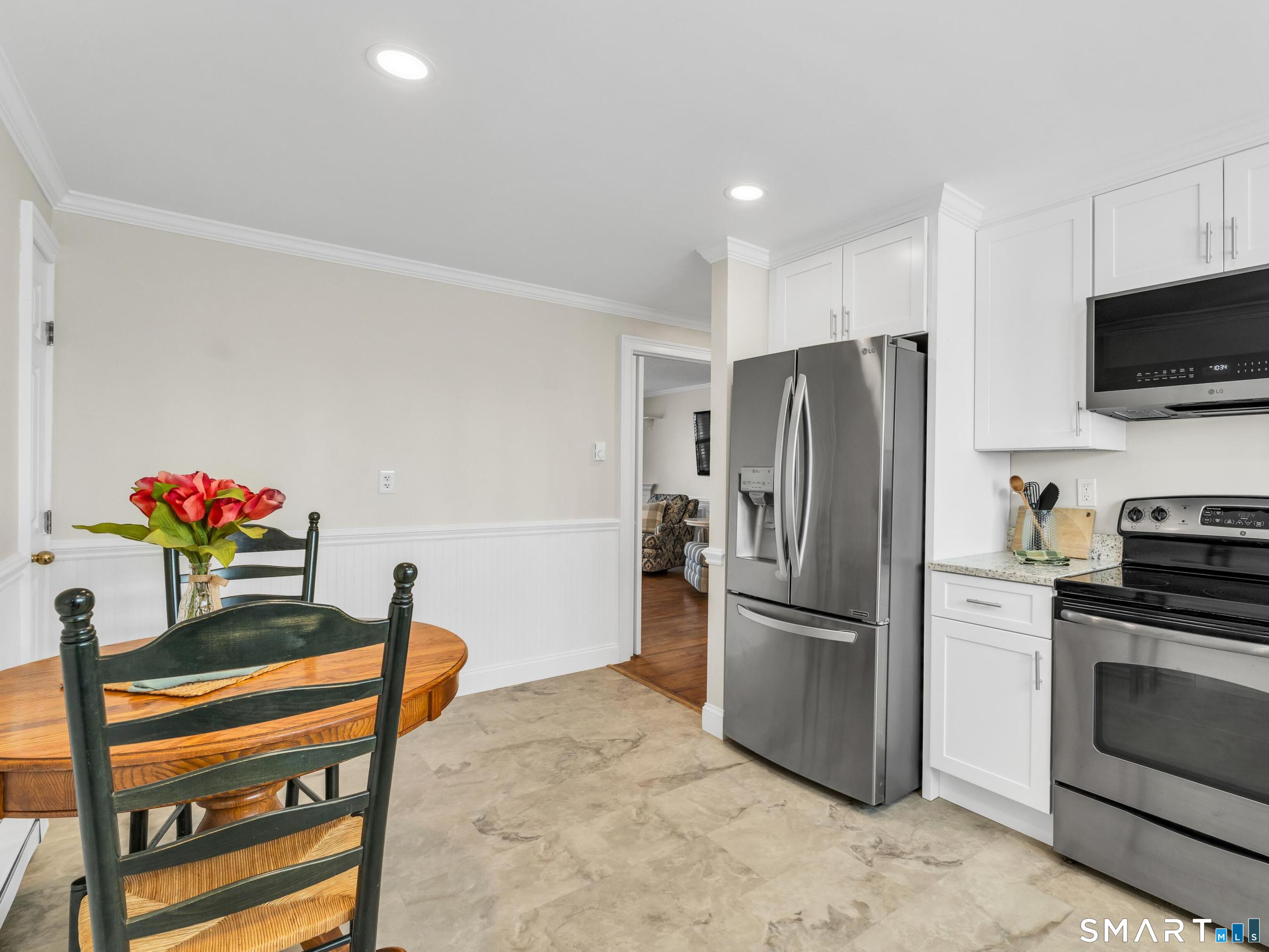 280 East Main Street, Unit B5 Clinton, CT 06413 - Photo 4 of 19 Newly renovated eat-in kitchen with high end self-closing kitchen cabinets, granite counters and new luxury laminate flooring.