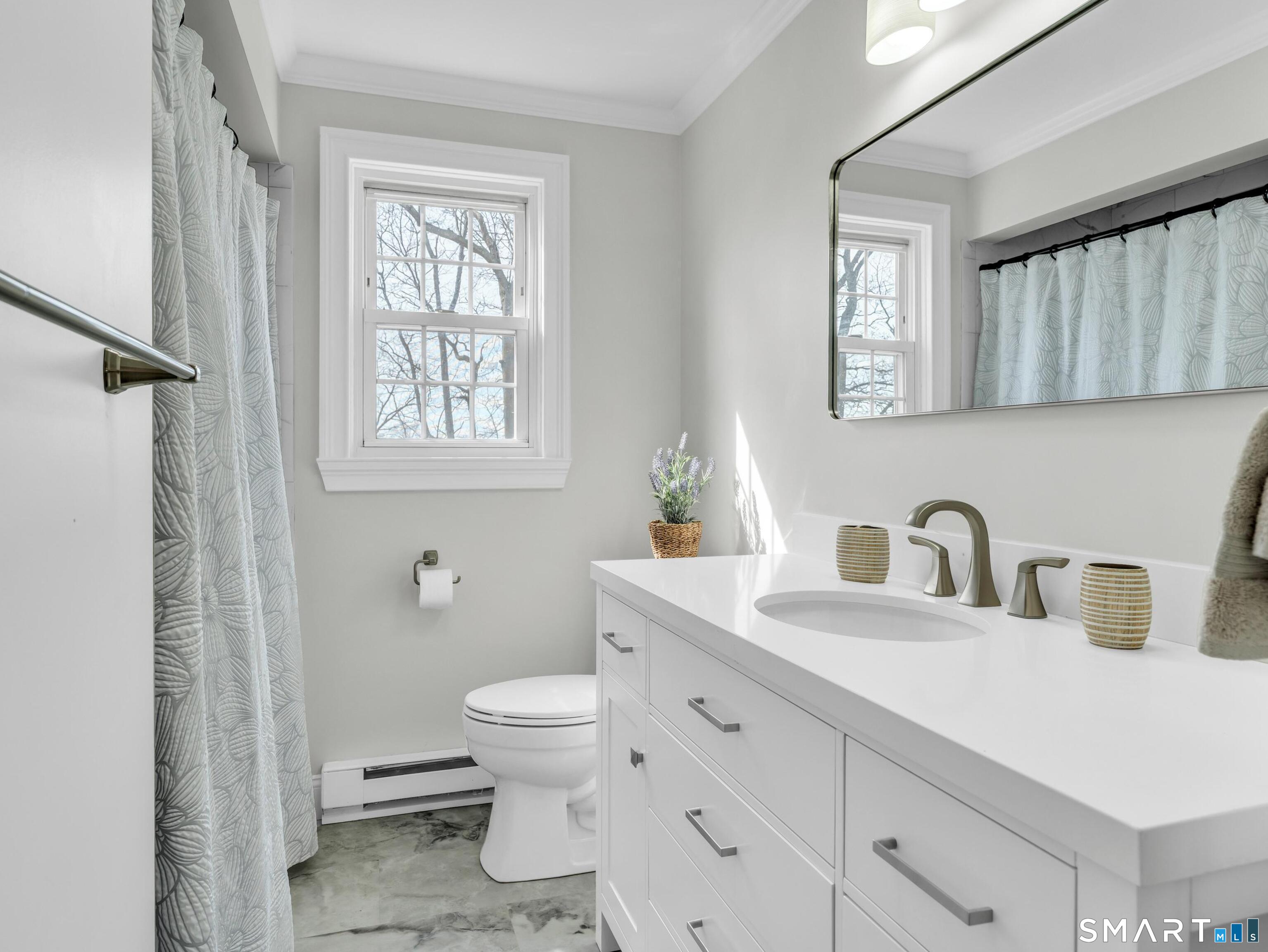280 East Main Street, Unit B5 Clinton, CT 06413 - Photo 10 of 19 Newly renovated bath with a high-end vanity with quartz counter and shower stall with built-in bench seating. New luxery vinyl flooring as well.