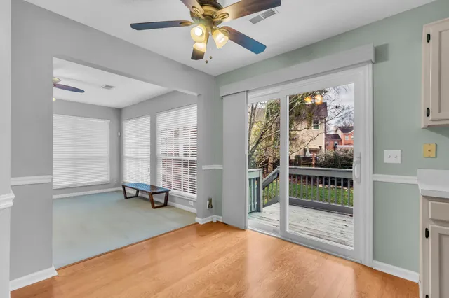 a view of room with window and ceiling fan