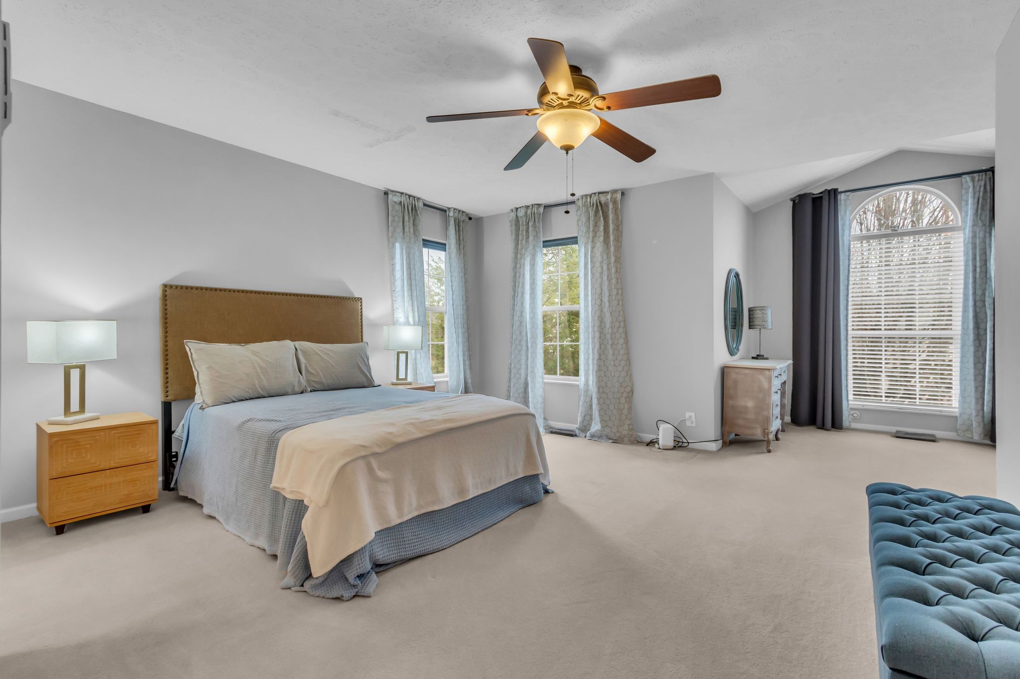 505 Hollyhock Way Franklin, TN 37064 - Photo 16 of 28 a spacious bedroom with a bed and a chandelier