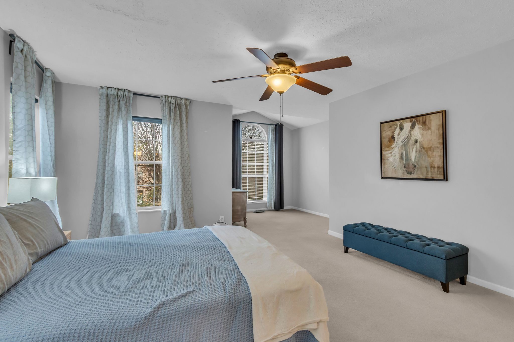 505 Hollyhock Way Franklin, TN 37064 - Photo 17 of 28 a bedroom with a bed and a chandelier