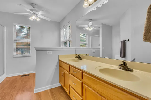 a bathroom with a sink double vanity and a mirror