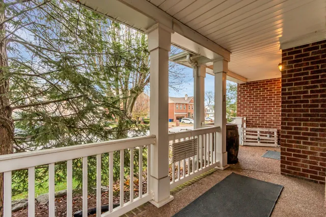 a view of a porch with wooden floor and fence